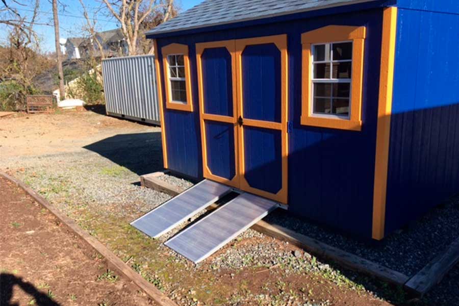 Ramp attached to a blue shed